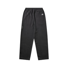 Umbro Censored sweatpants in washed black with relaxed fit and elastic cuffs