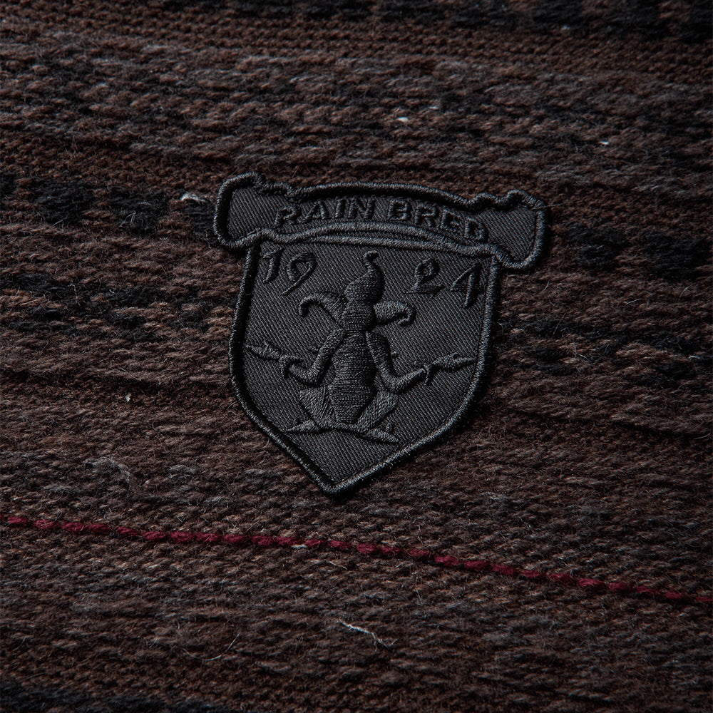 Umbro Fair Isle Crest crewneck sweater in black and brown with multicolor patterned knit design
