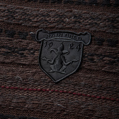 Umbro Fair Isle Crest crewneck sweater in black and brown with multicolor patterned knit design