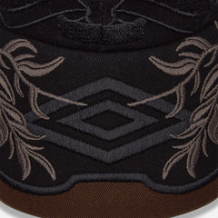 Umbro Laurel Cap in brown, classic headwear design with adjustable back strap