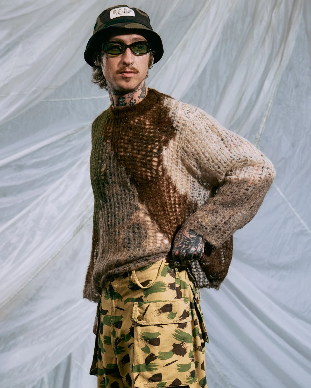 Olive organic Threadbare sweater by Brain Dead, featuring a relaxed fit with textured knit fabric and ribbed cuffs.