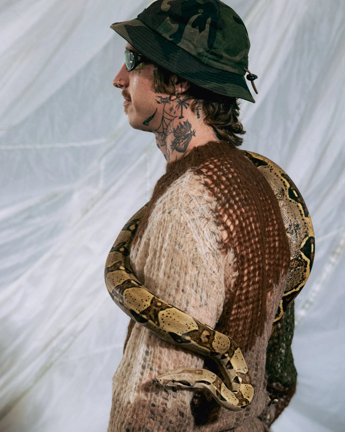 Olive organic Threadbare sweater by Brain Dead featuring a relaxed fit and soft knit fabric, styled on a model.