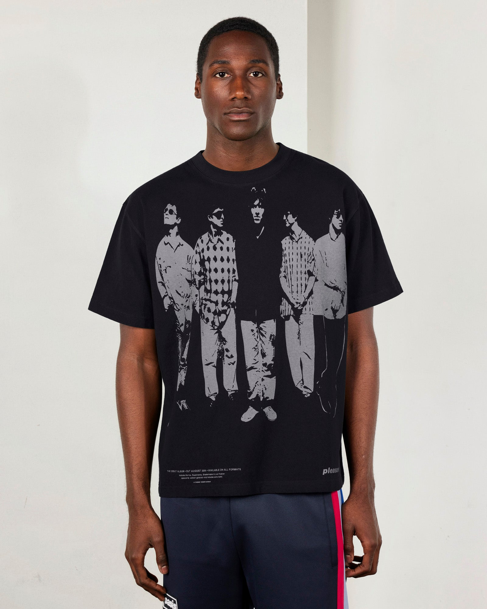 Faded black heavyweight T-shirt by Pleasures featuring a casual fit and minimalist design, shown on a neutral background.