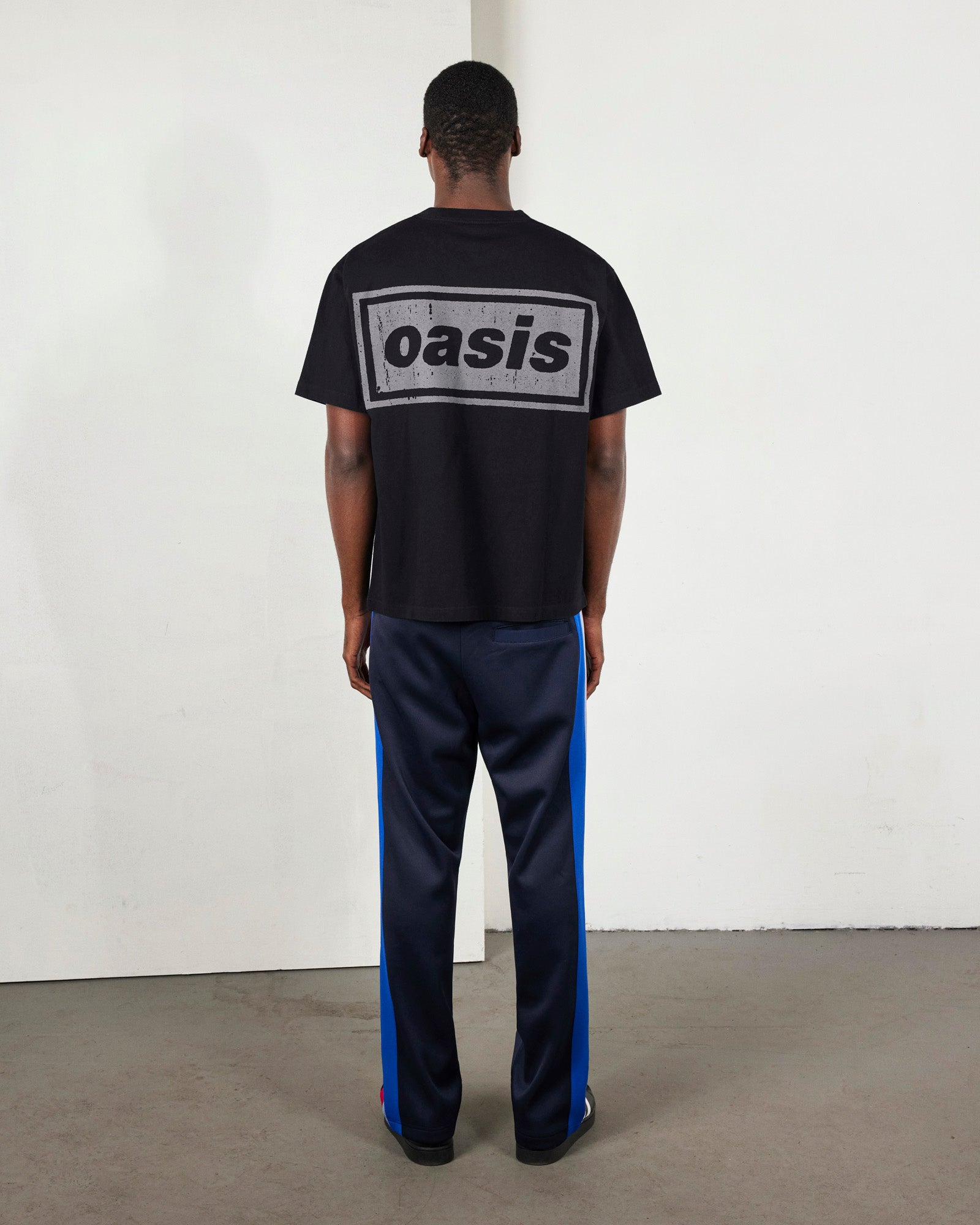 Faded black heavyweight Pleasures T-shirt with graphic design, showcasing a casual and stylish fit.