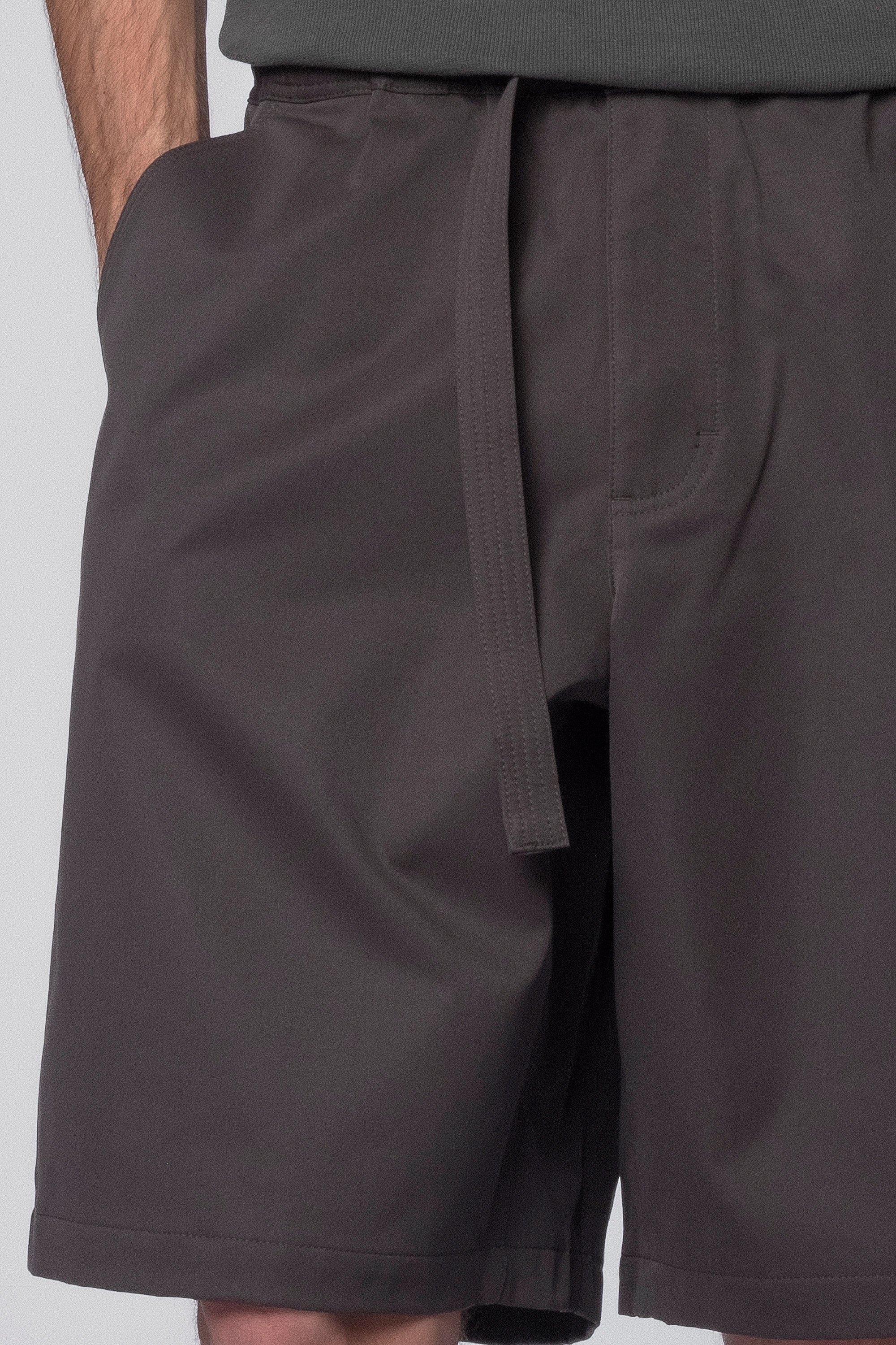 Dark grey Proof Shorts by Beach Brains displayed on a model, showcasing casual men's shorts with a comfortable fit and stylish design.