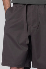 Dark grey Proof Shorts by Beach Brains displayed on a model, showcasing casual men's shorts with a comfortable fit and stylish design.