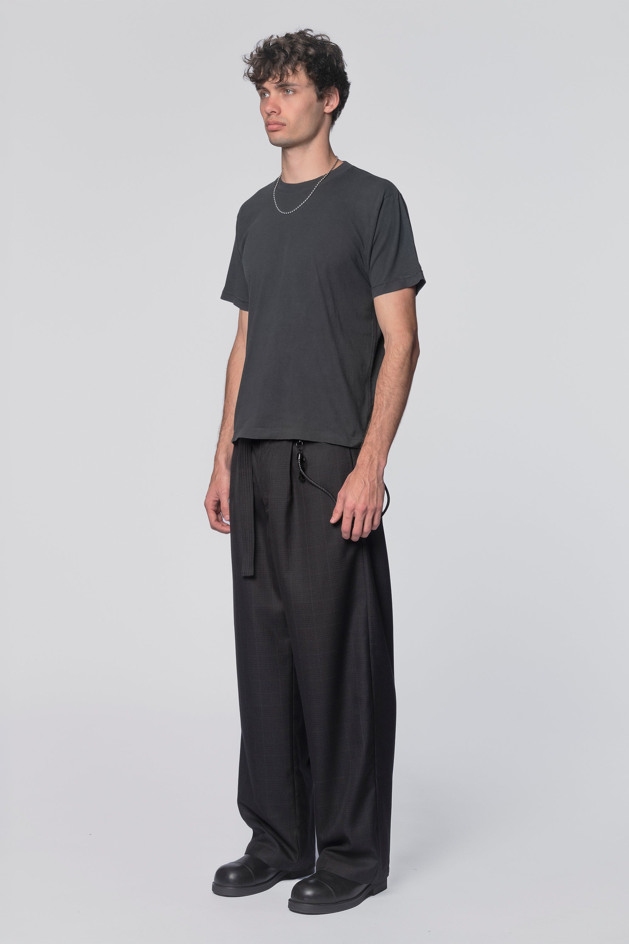 Black Tide T-Shirt by Beach Brains featuring a casual fit and ocean-inspired design, displayed on a neutral background.